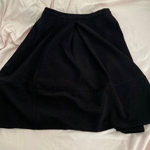 Adorable black skirt goes up to your knees, great material